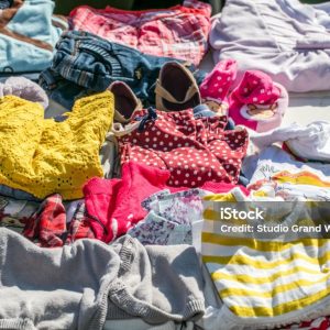 display of second hand baby and children clothes for reusing, reselling,recycling,donating or welfare for second life sold at outdoor garage sale